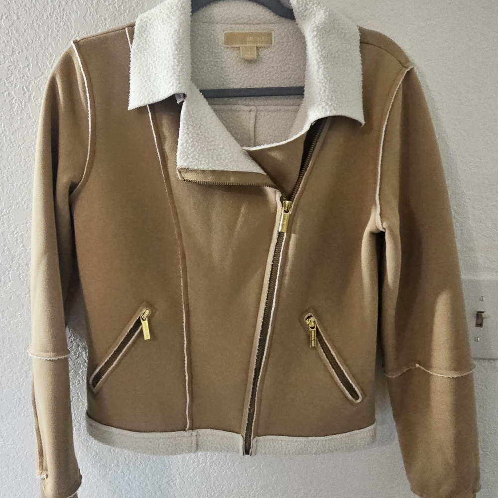 Michael Kors tan sherpa-lined moto jacket.